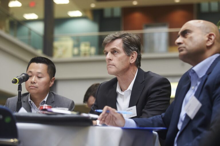 Panel of 3 judges sitting at a table