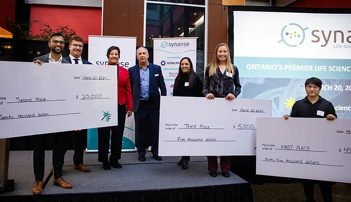 Winners of the 2024 Synapse Pitch Competition Winners being presented with a cheque